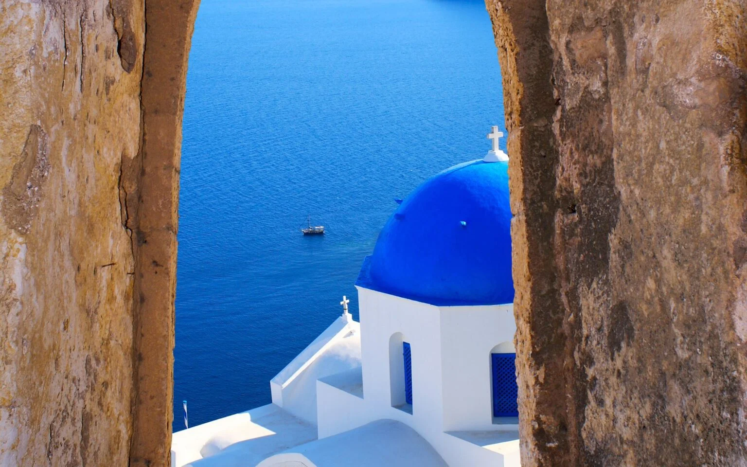 Last but, definitely, not least comes Santorini, an island renowned for its breathtaking sunset. Some claim that Santorini is ‘heaven on earth’ as the view from Oia combined with the whitewashed buildings, the traditional windmills, and the blue dome churches shape one of the most stunning views one can witness. At the same time, Santorini has an international airport (JTR) with flights to numerous European capitals to further facilitate you and ease your transportation.